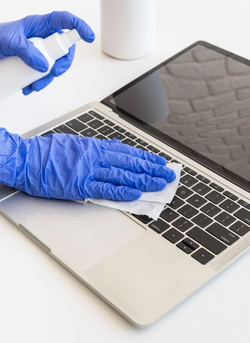 person-disinfecting-laptop (1)
